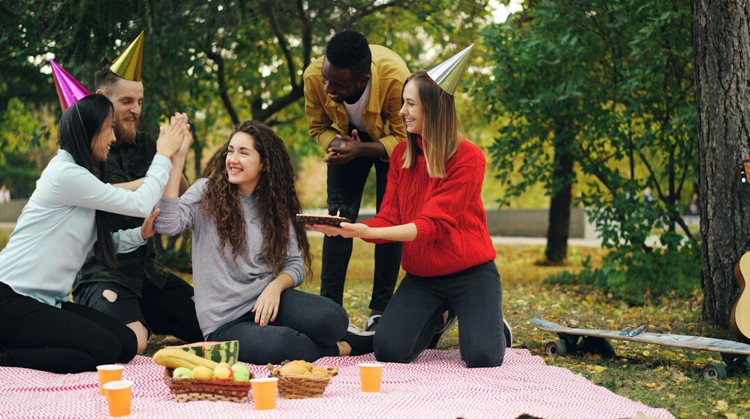 friends enjoying picnic outdoors