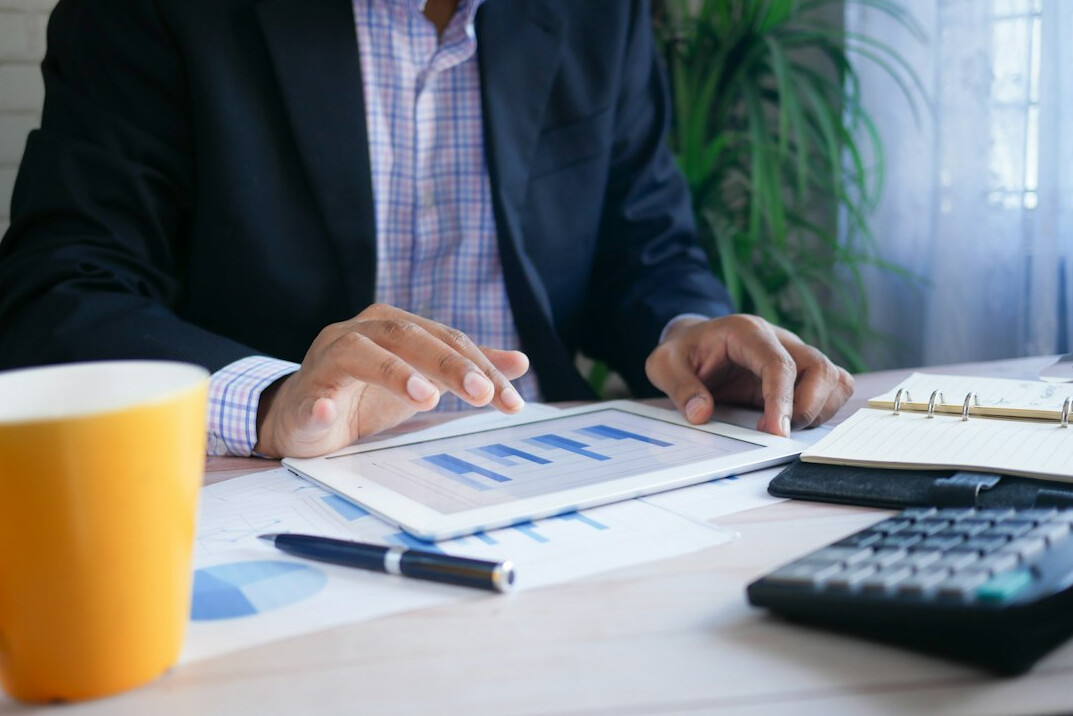 person setting financial goals on tablet