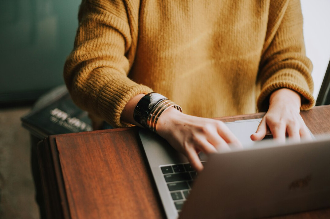person using laptop for budgeting