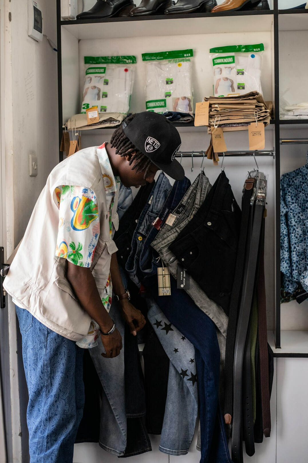 person shopping at thrift store