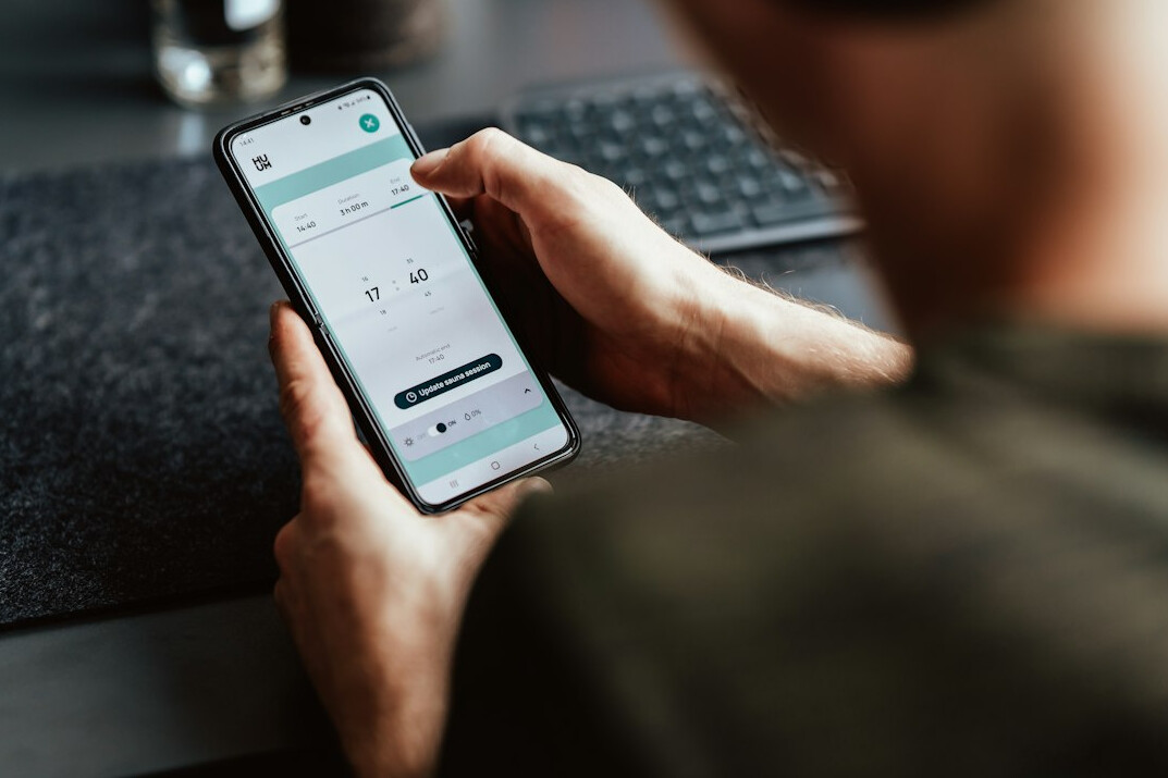 person tracking expenses on phone