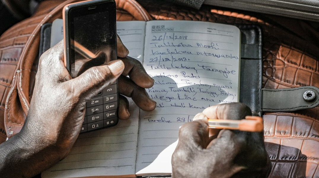 person checking budget on phone